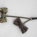 Double Metallic Bow iPhone Headphone Plug/ Dust Plug - Cellphone Accessories