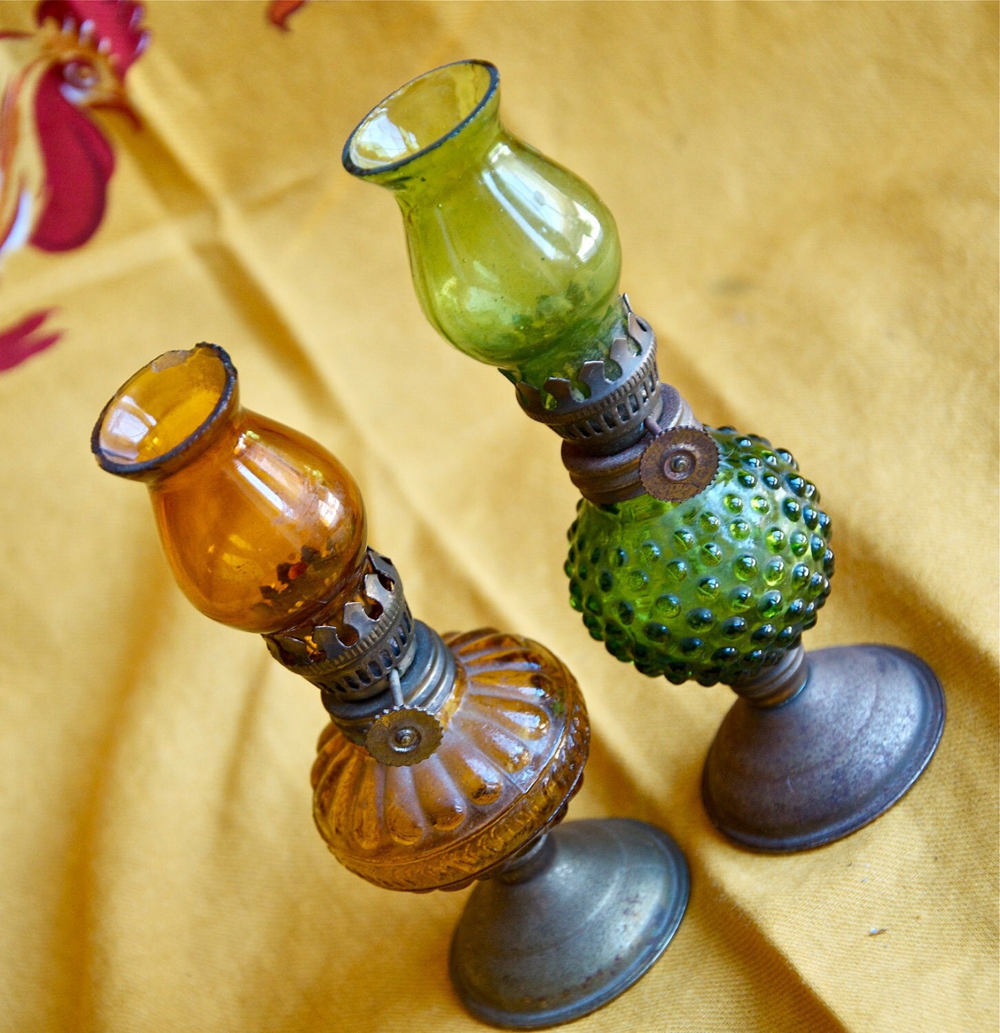 Two vintage mini oil lamps...green and yellow glass lamps.