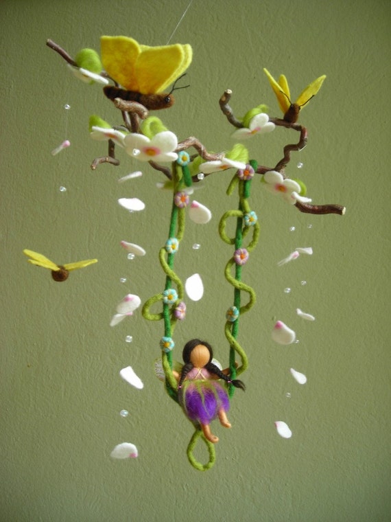 fairy on a swing garden ornament