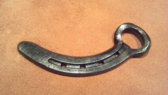 Items similar to Bottle opener made out of a horseshoe on Etsy