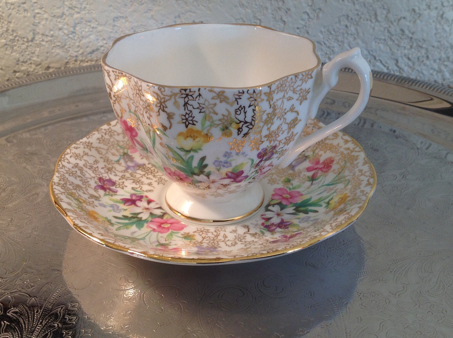 Queen Anne bone china tea cup and saucer. Multicolor floral