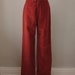 70s vintage women's fuzzy Levi's Juniors pants, high waist, pipe leg, wide leg, brick red, orange red, velour, velvet, 26 inch waist