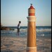 Lighthouse Pepper Mill in Olive Ash & Holly Details with Padauk Lantern and Ash Fresnel atop Marbleized Hard Maple Base