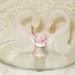 SWAROVSKI frosted hand blown glass swan pair with porcelain rose on mirror