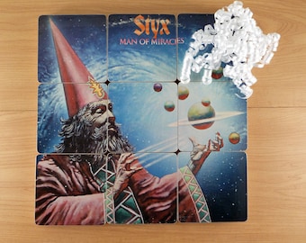 Styx handmade wood coasters with warped record bowl from recycled Man of Miracles music album