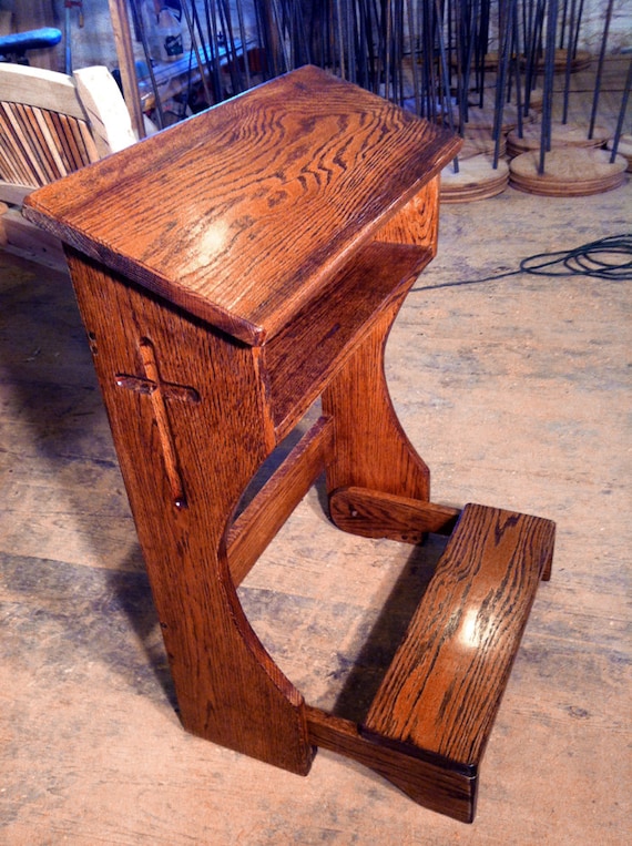 prie-dieu is a kneeling bench. prayer room, stained