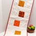 Autumn table runner- quilted, large- with orange, rust, mustard on creamy white "Gratitude"
