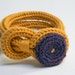 Mustard yellow and purple knitted wool yarn bracelet Noemi, crocheted button, tied up, yarn jewelry