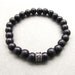 Mens black wooden beaded stretch bracelet with tibetan style patterned bead 1