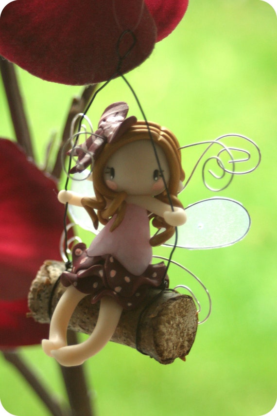 fairy on a swing figurine