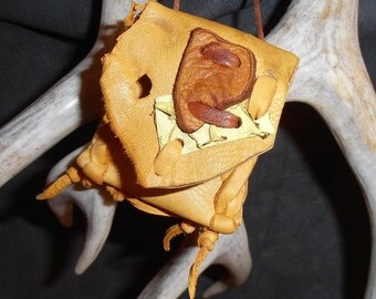 Sun Glow- This Wisdom Pouch is made out of Gold colored Leather that has accents of Tan Leather and Yellow/Green Fish Hide Leather