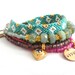 Bohemian hippie gypsy bracelet - multiple rows in pink lavender and seagreen with friendship bracelet golden hearts and handstamped tag