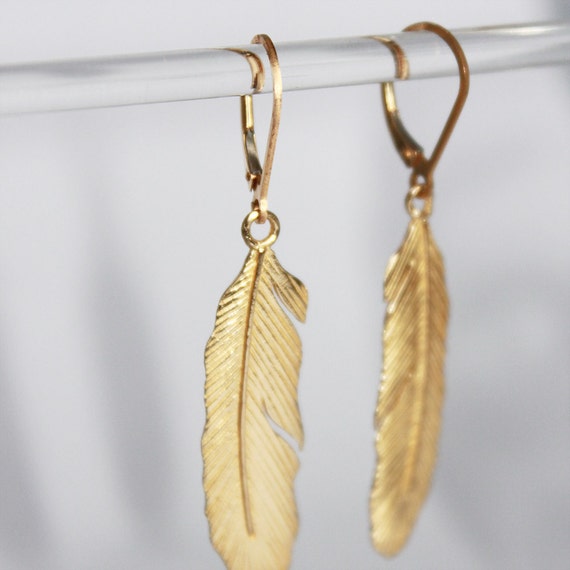 delicate feather earrings. brass with 14k gold. lightweight