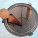 steel ricer with metal stand and wooden pestle -- cool industrial vintage for your home