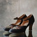 1930S embroidered black satin heels.