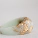 mint and gold multifaceted eco resin ring with suspended gold flakes