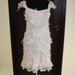 shabby chic...vintage ivory slip laden with shabby pieces of crochet, and ruffle lace trims...