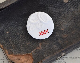 round white clay brooch with red stitches - delicate lace imprint brooch - white textured brooch - red stitches brooch