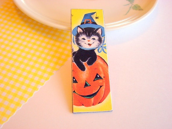 Black Cat Wearing a Witches Hat in a JackoLantern by mimiandlucy