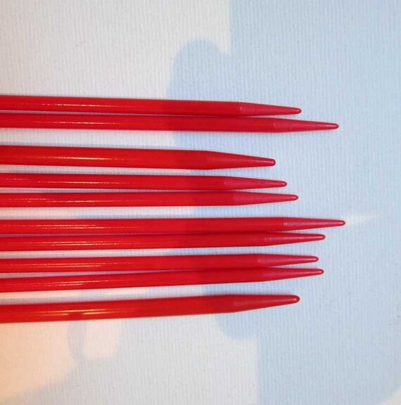 Vintage red and cream plastic knitting needles supplies