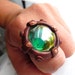 Steampunk Porthole Ring with Iridescent Green Glass Gem