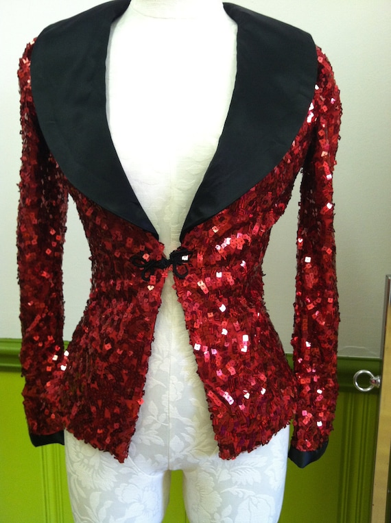 Red stretch sequin jacket with black cuffs and collar