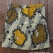 Elastic waist skirt, front pockets - African print yellow and olive green flowers pattern. Adult size Medium