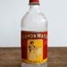 Vintage embossed Kormon bleach glass bottle