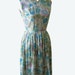1950s spring cotton dress. soft pastel floral. sleeveless. cinched waist. light green. blue. pink. mid century mod.