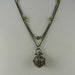 Prayer box necklace antique gold toned with double chain green and mauve crystals opens toggle clasp
