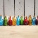 Vintage 12 Miniature Bitters medicine bottles beautiful suncatchers and perfect for oil blends, cell salts, homeopathy pellets 3 inches