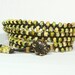 Triple wrap bracelet. Green, brown, cream TOHO seed beads. Chocolate dark brown cord. Antique brass flower button. Hippie.
