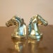 Vintage pair of gold horse head bookends Hollywood Regency