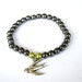 SALE Hematite and Glass Pearl Stretch Bracelet with Bird Charm
