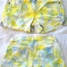 Low Waisted Distressed Tie-Dye Denim Shorts