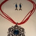 Unique Handmade beaded necklace with silver and blue centered crystal medallion