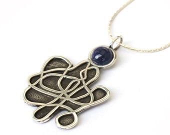 Unusual Tangle Silver Pendant with a Gemstone .