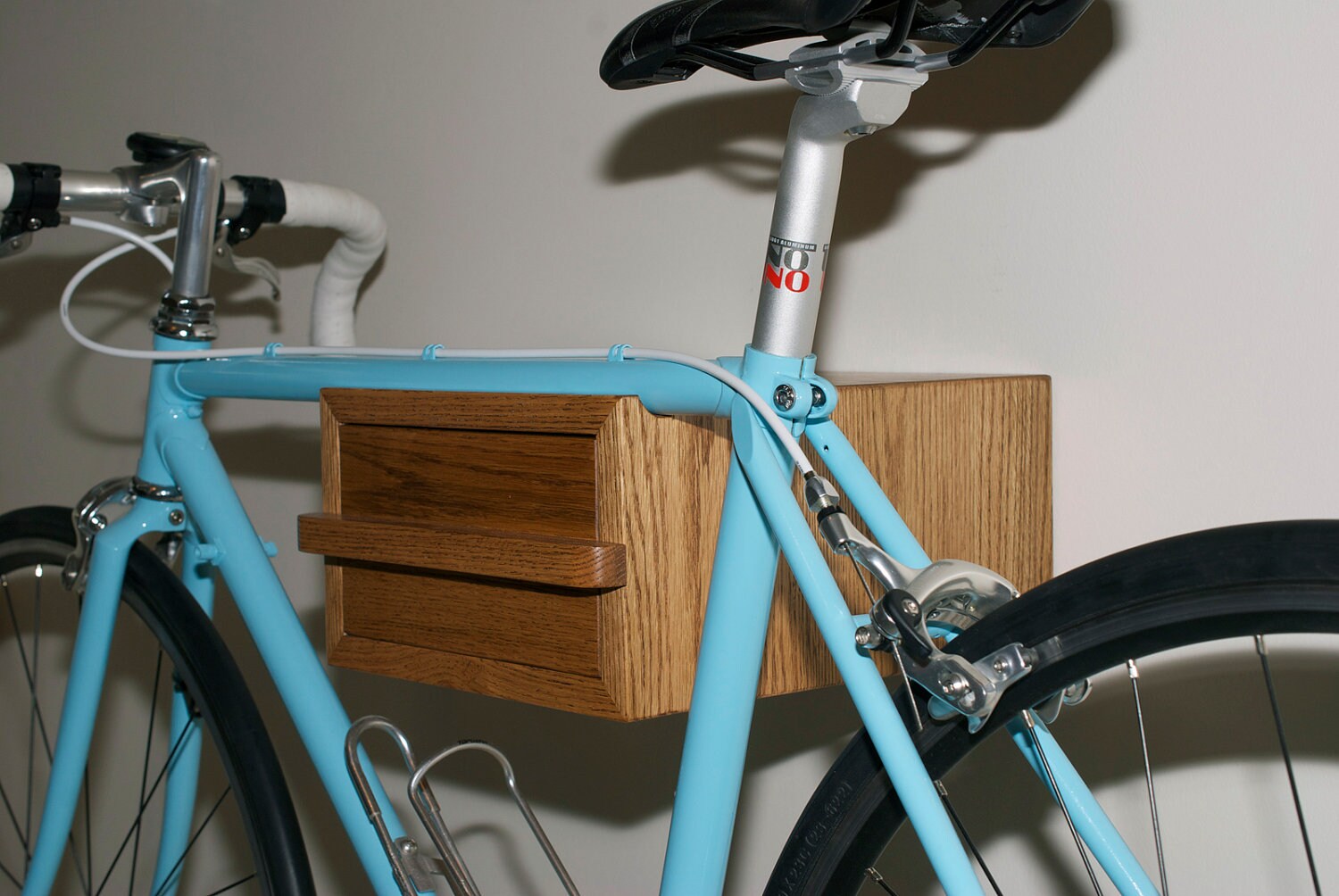 Wooden wall mount bike rack for bicycles. by Donswoodcreations