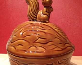 Walnut shaped nut dish with a squirrel on top