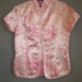 Shiny PINK oriental top grew HOT pink cherry blossoms all over it