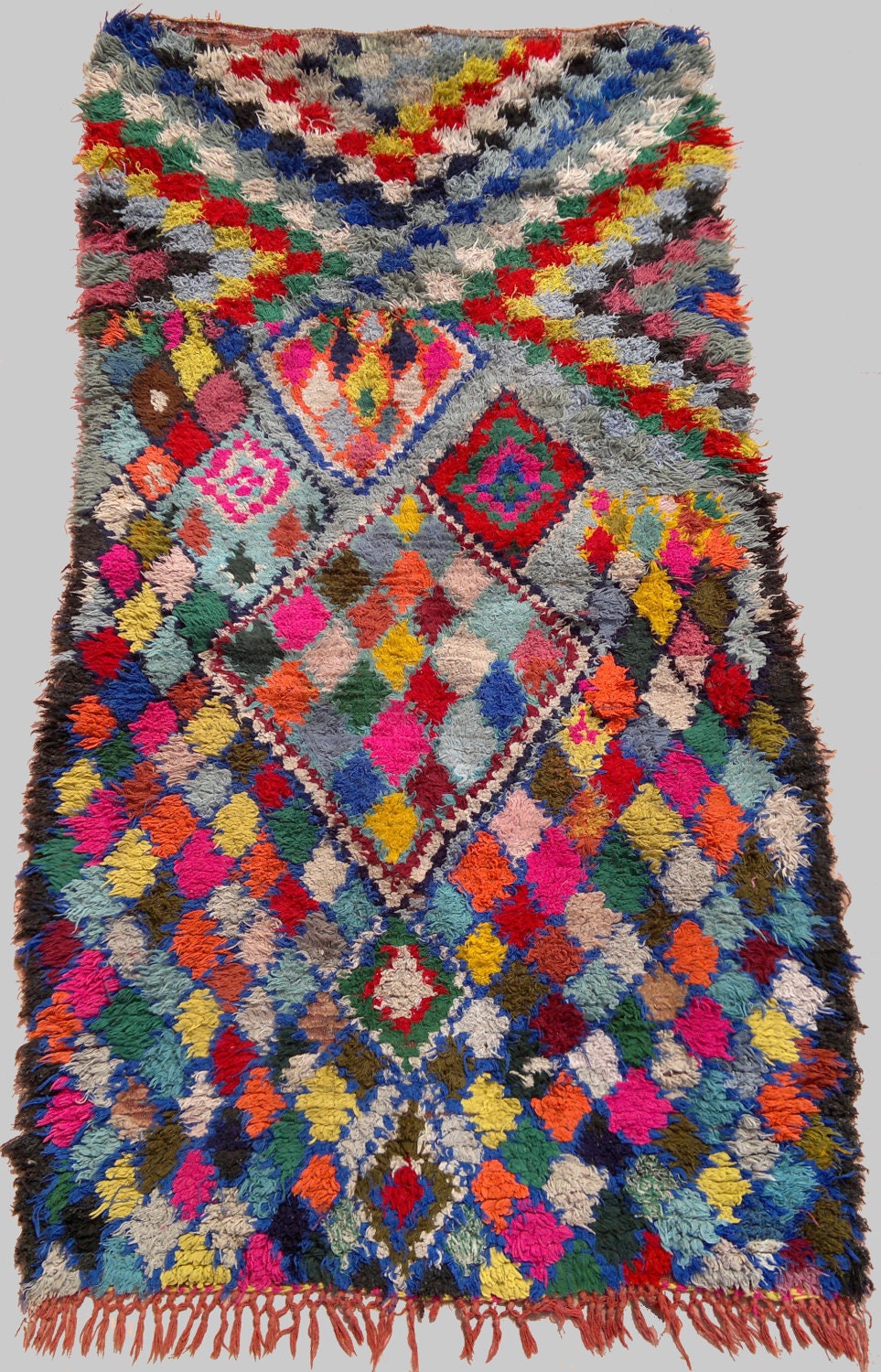 vintage Moroccan rug woven by hand from scraps of fabric