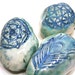 ceramic pebble rattles - rose, feather and crystalline
