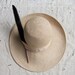 SALE // vintage 1970s wide brimmed straw hat with cattail "feather"