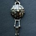 shield pendant in silver and bronze