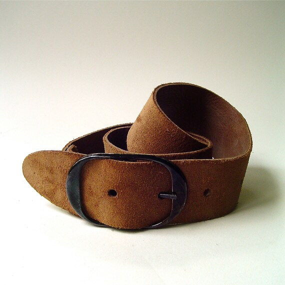 You are here Rated 5 out of 5 by FFfan from Runs small This is the perfect wide suede belt! I have it in both colors. However, I'd say it definitely runs small. I first ordered the S/M but had to return for the M/L. My waist is and I usually wear a size in dresses. I could not easily fasten the S/M, but the M/L works great.