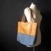 The Book Tote: eco-friendly leather and railroad denim.
