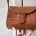Small boxy woven leather shoulder bag or crossbody bag