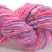 handspun sparkly corespun art yarn Oh So Pretty 60 yds pink and purple merino wool, glitz, tencel, mohair locks
