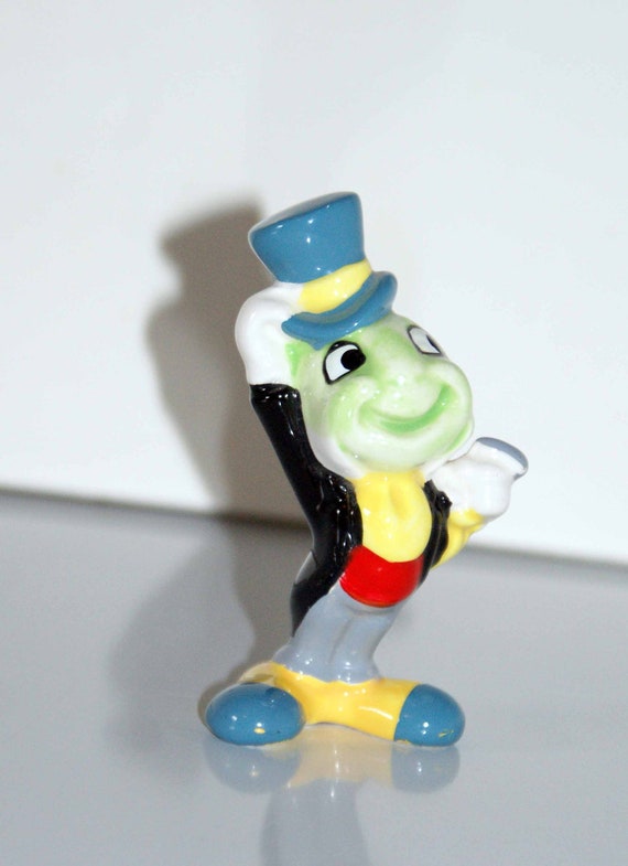 antique jiminy cricket figurine