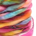 Handspun rainbow yarn, spun thick and thin in merino wool- 25 yards, 2.0 ounces/ 57 grams